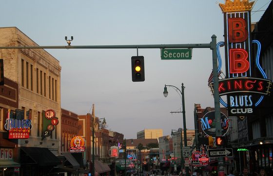 Beale Street in the evening, neon and shopfronts along the block