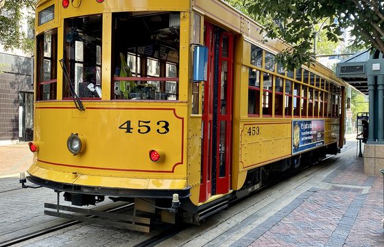 A Main Street trolley car standing at a stop in downtown Memphis
