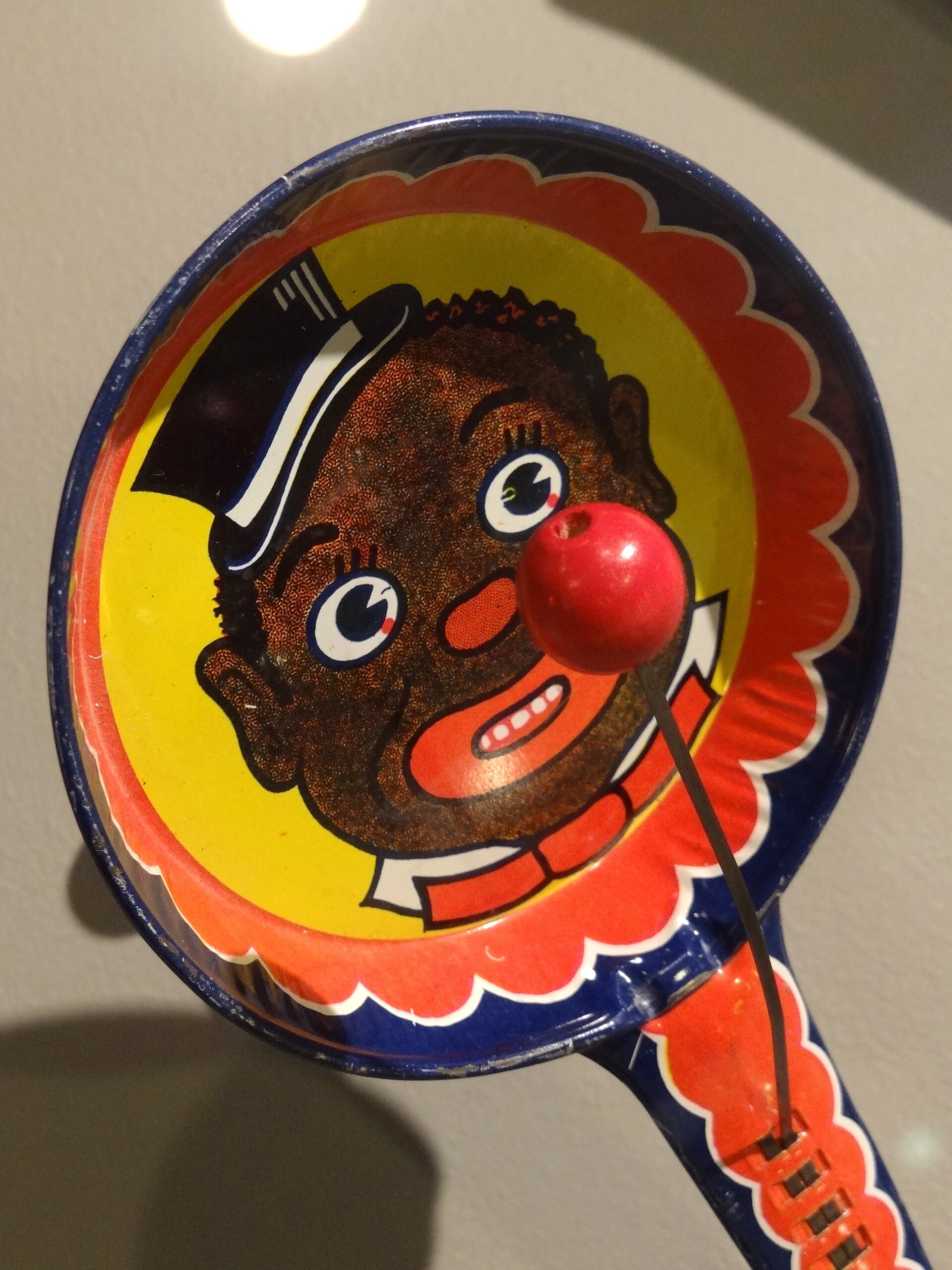Noisemaker bearing a racist depiction of a Black minstrel, displayed at the National Civil Rights Museum in downtown Memphis