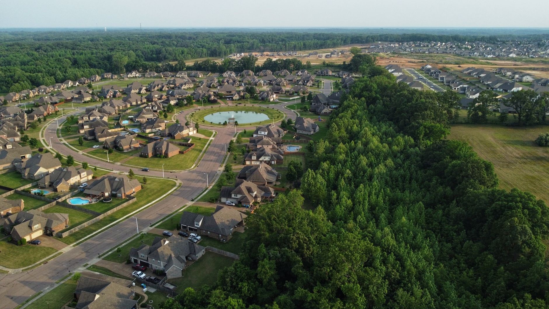 Aerial view showcasing a suburban neighborhood in Memphis with houses and trees