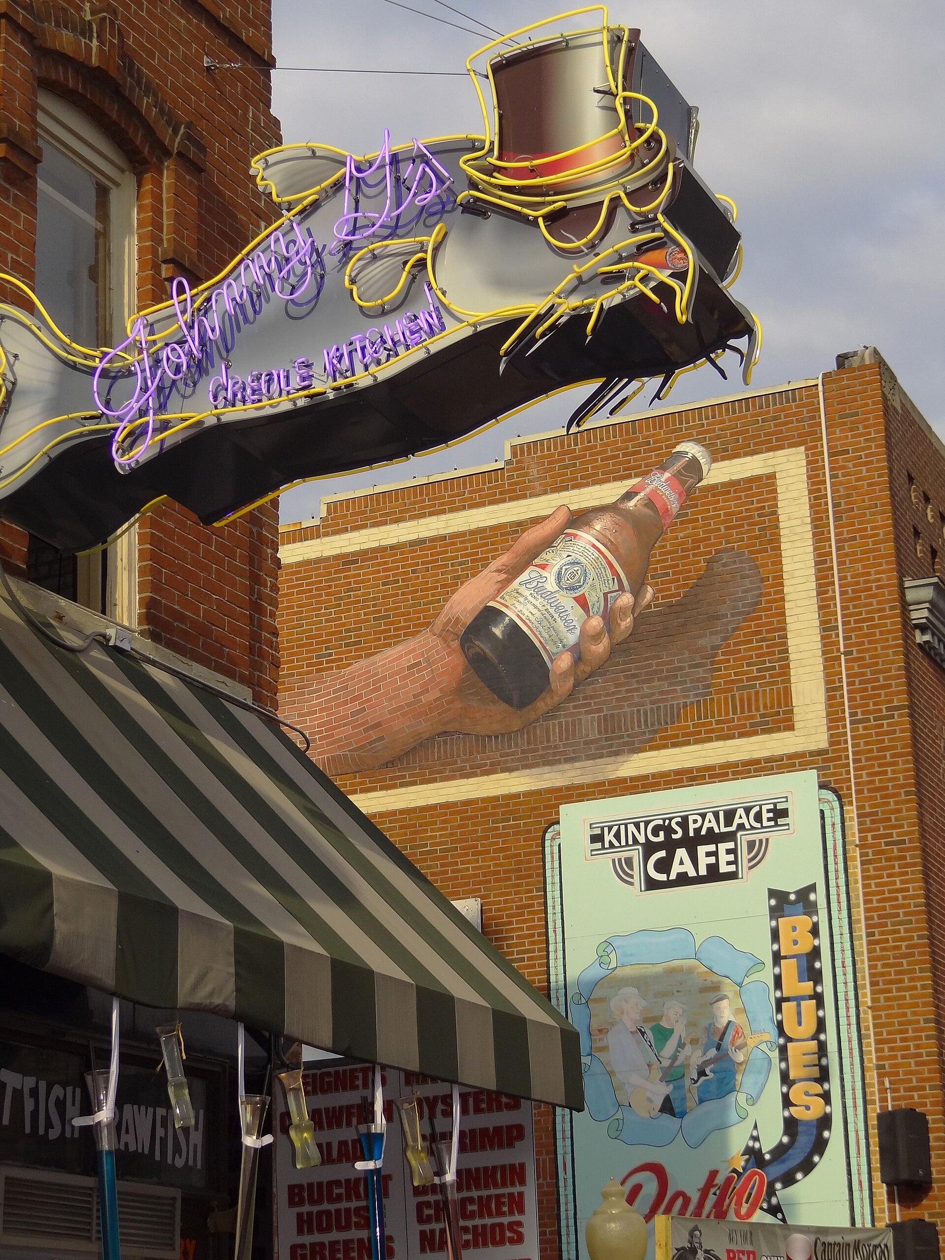 A pastiche of signs and storefronts along Beale Street in downtown Memphis, Tennessee
