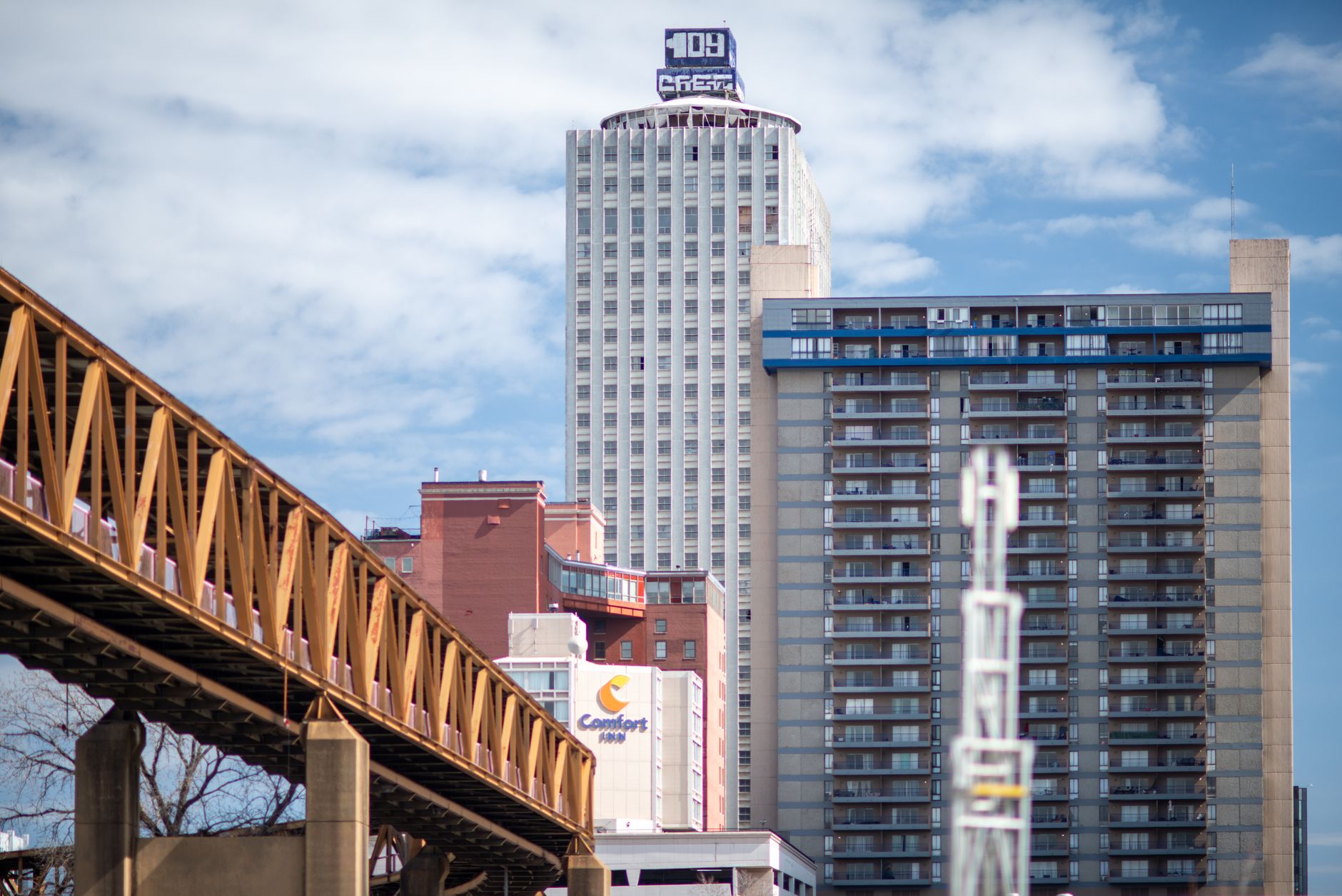 Skyline view capturing bridges and buildings in downtown Memphis, Tennessee under a bright sky