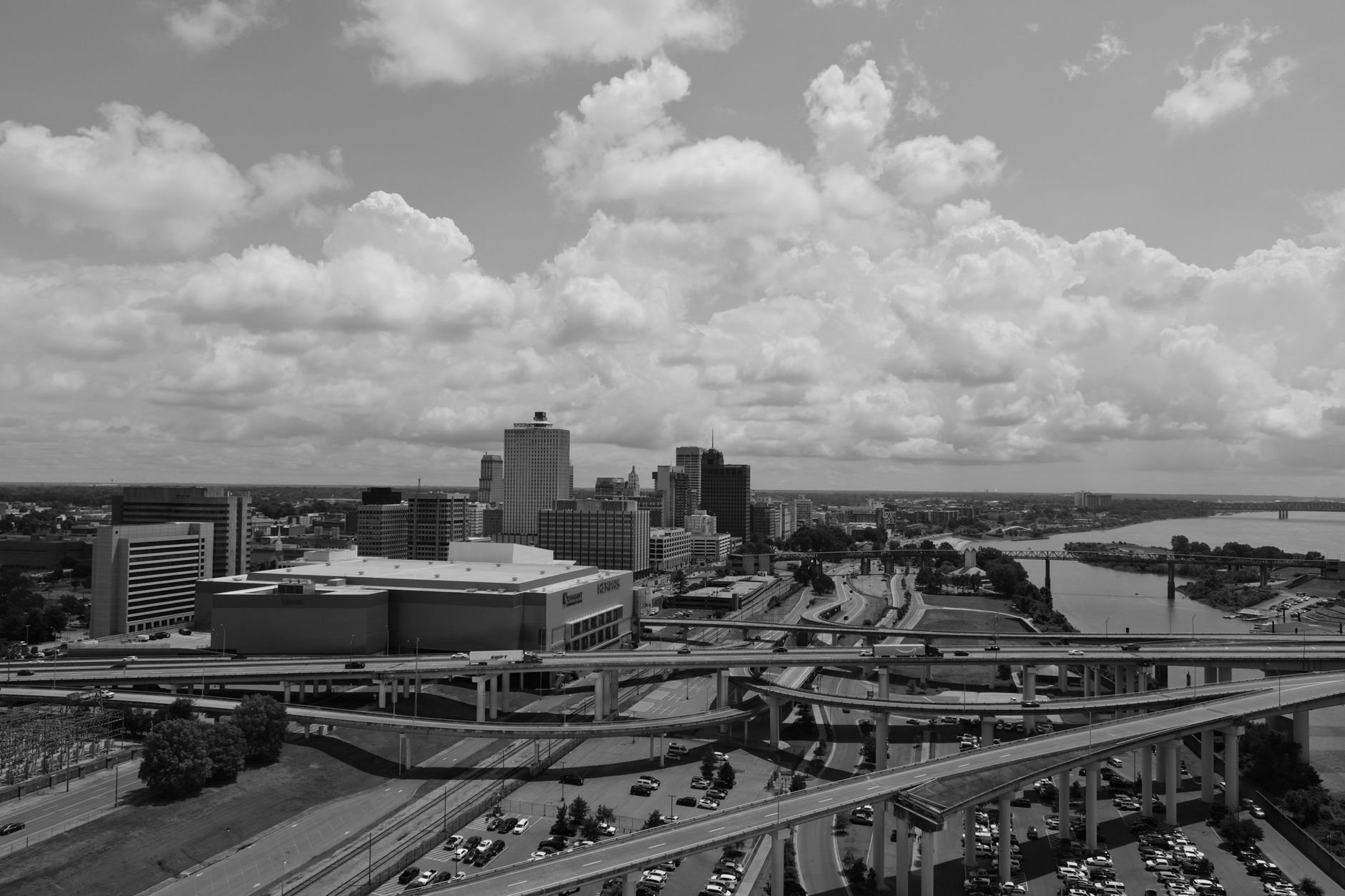 Aerial view of the Memphis skyline with highways and the river in black and white