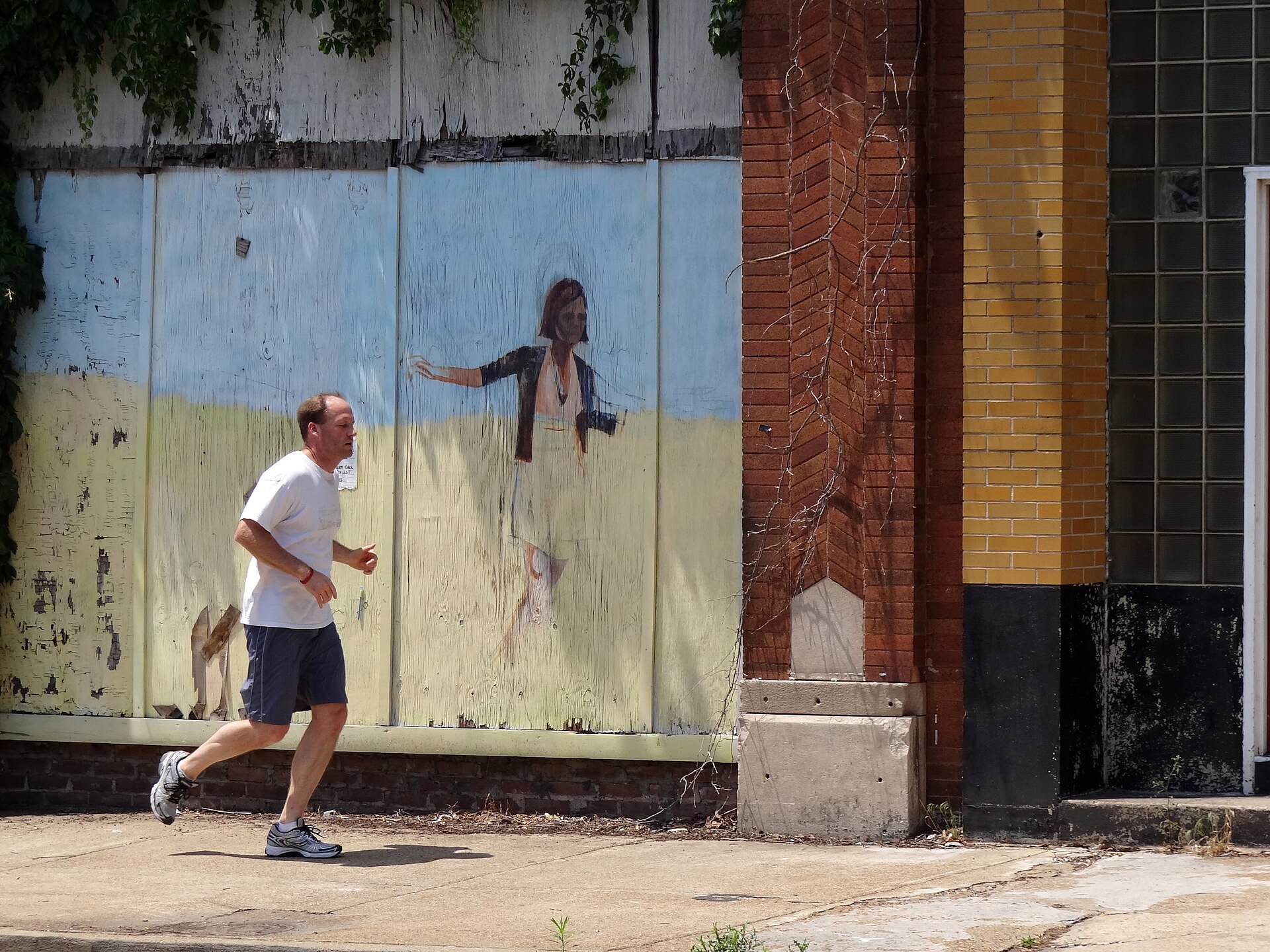 Street scene with a jogger in downtown Memphis, Tennessee